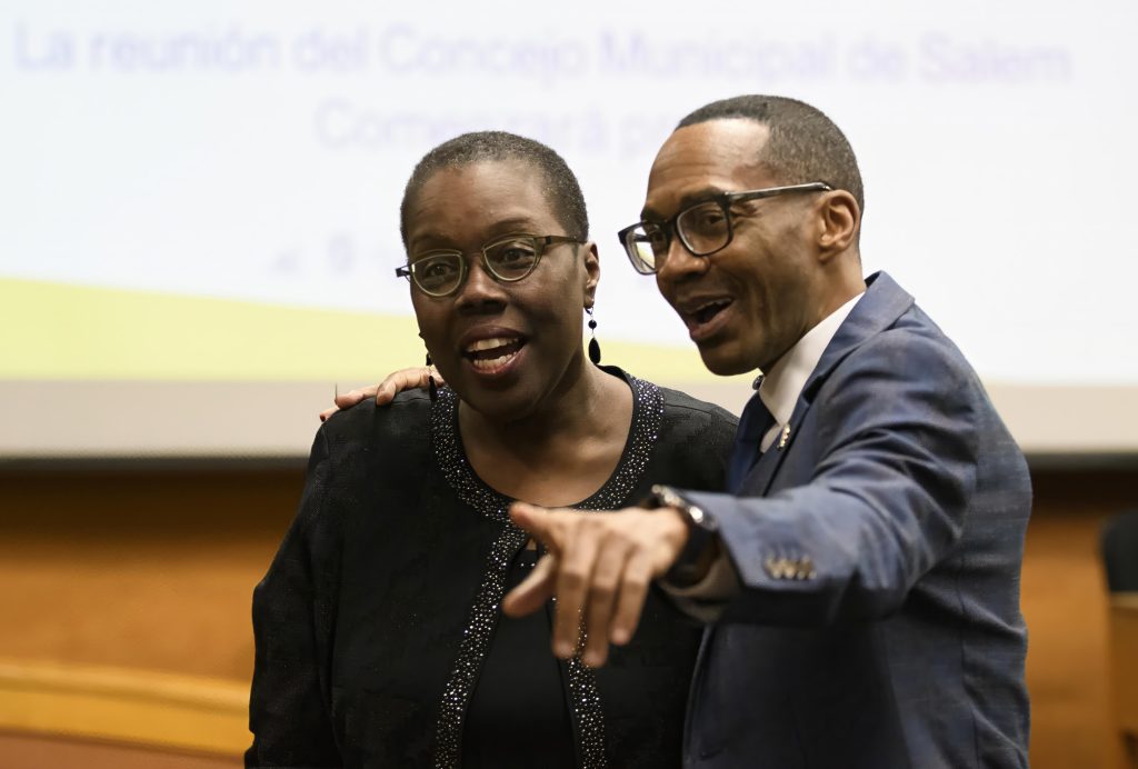 Dr,Brown hugging a lady pointing